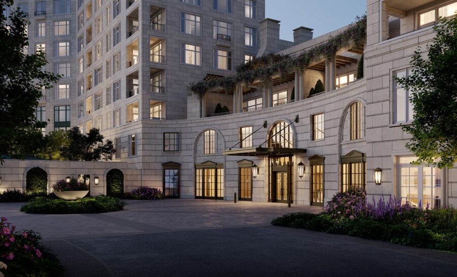 Elegant stone apartment building with large windows, arched entryway, and landscaped courtyard featuring flowers and greenery, reminiscent of The Woodlands or the refined style of Ritz-Carlton Residences.