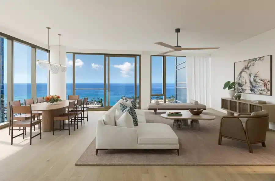 Modern open-concept living and dining area with large windows, ocean views, light wood flooring, contemporary furniture, and neutral decor.